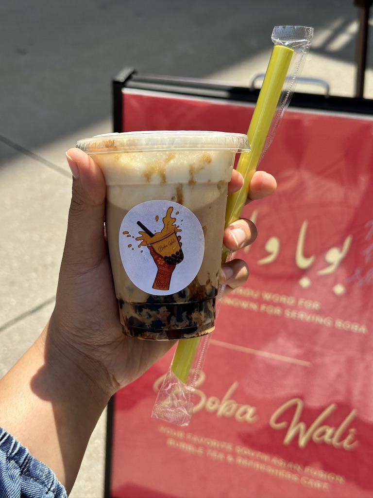 Brown sugar milk tea held in hand
