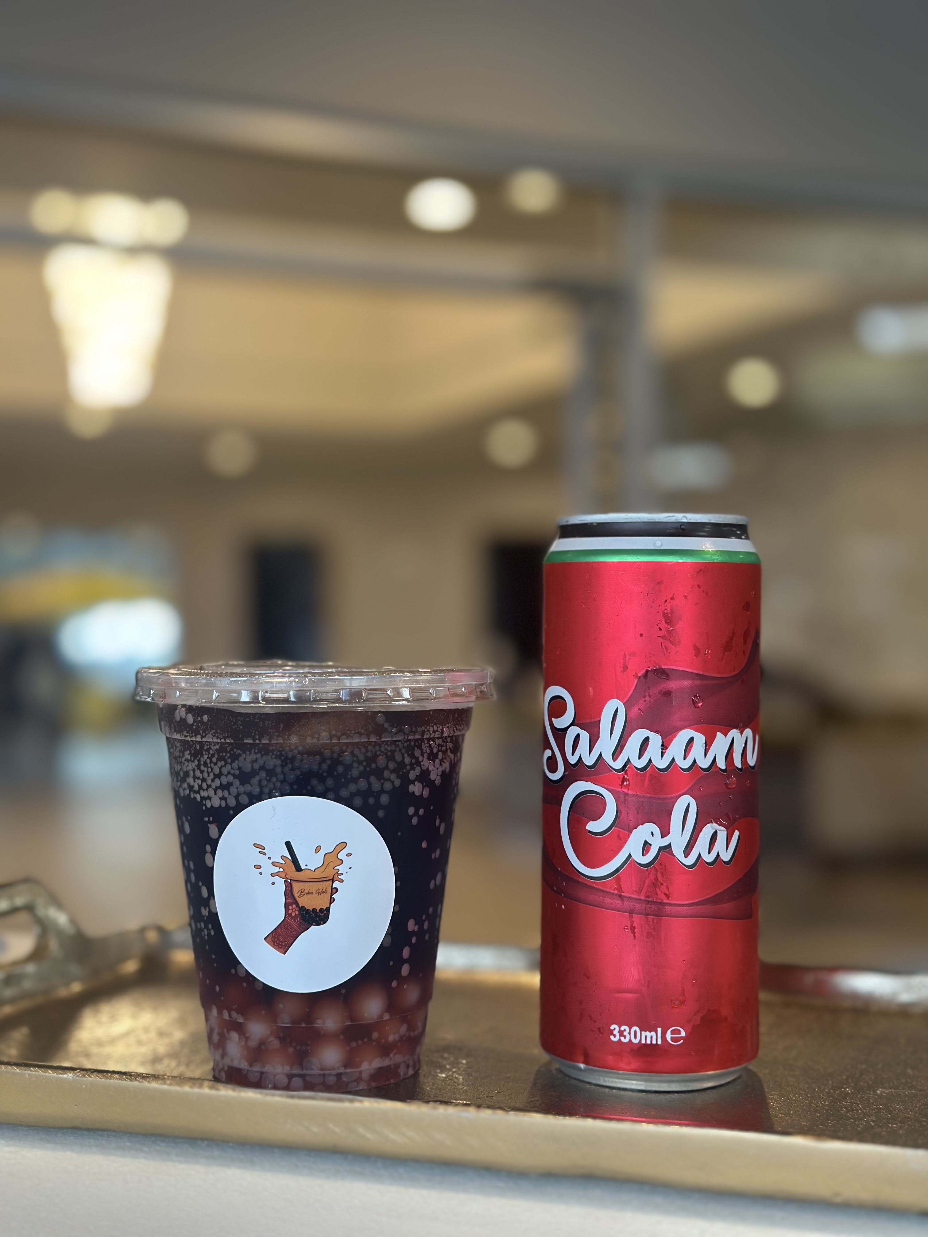 Boba drink alongside a Salam Cola