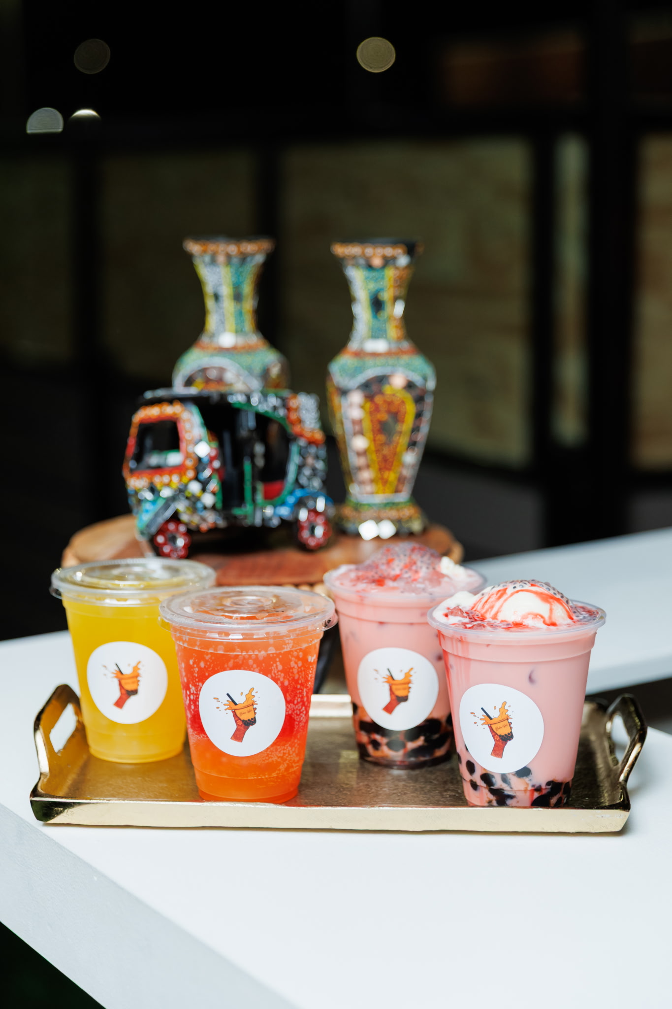 Tray of four assorted bubble tea drinks