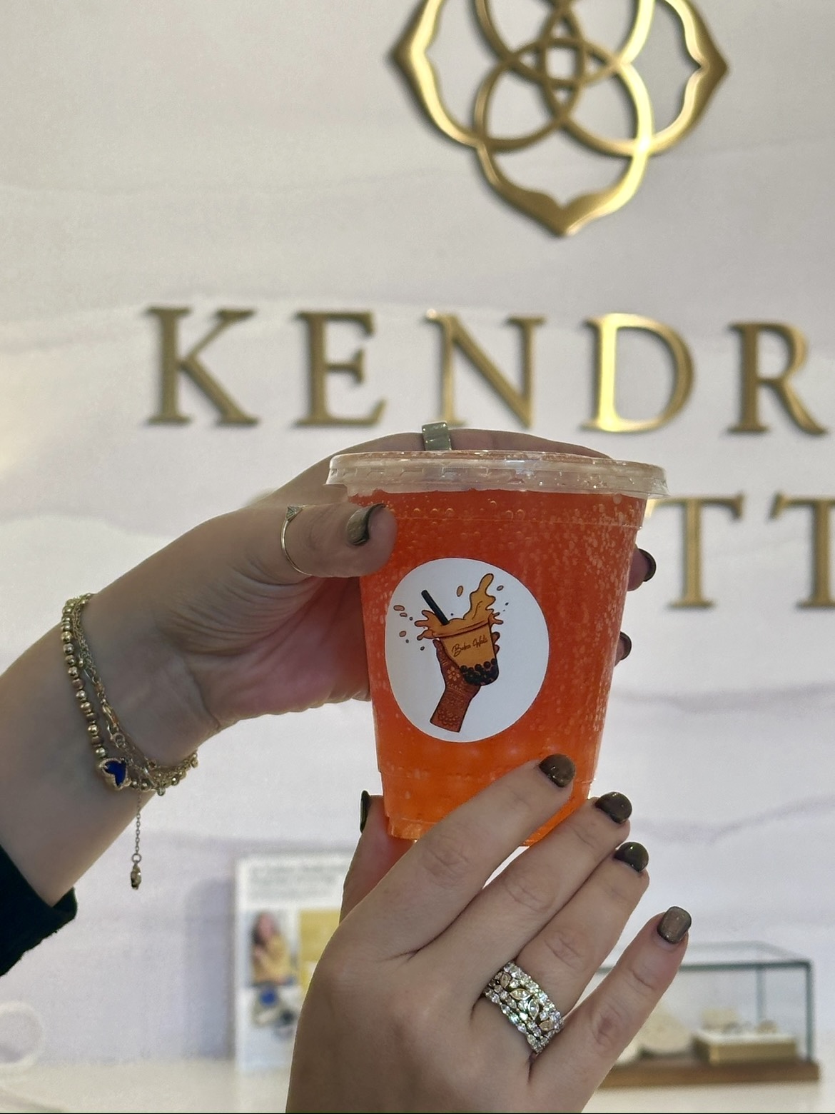 Orange fusion drink at a Kendra Scott event