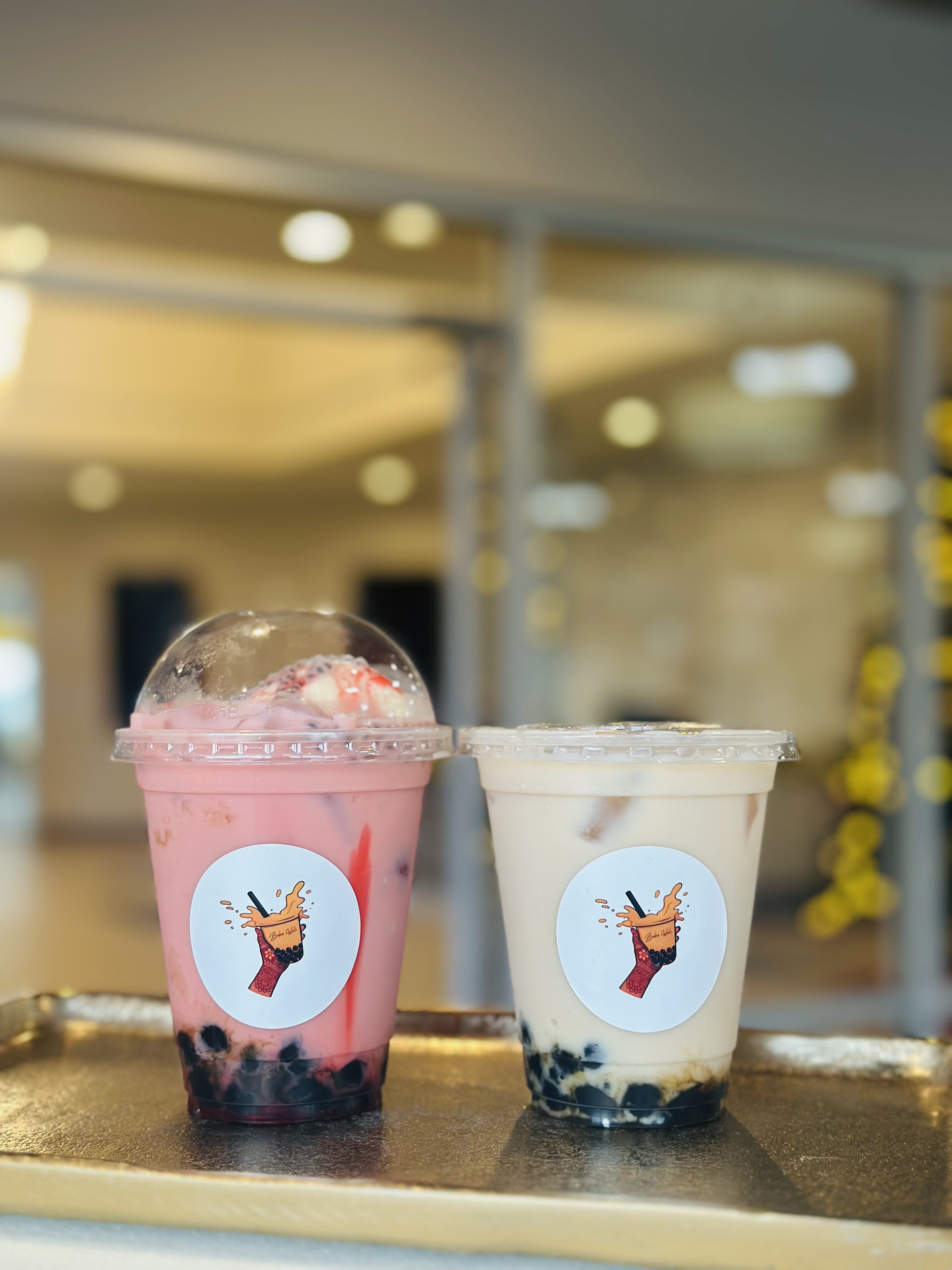 Pink and brown drinks side by side