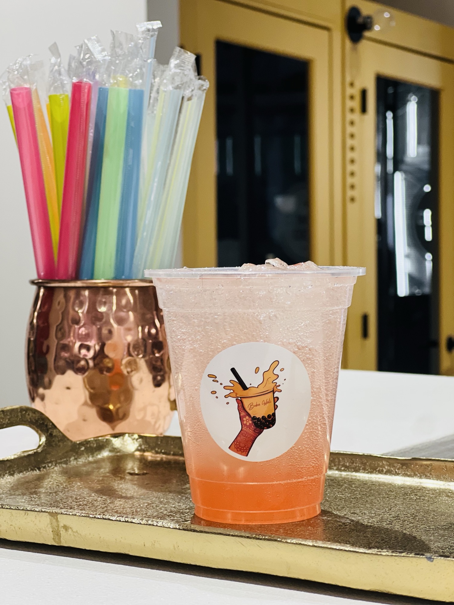 Pink lemonade drink with striped straws